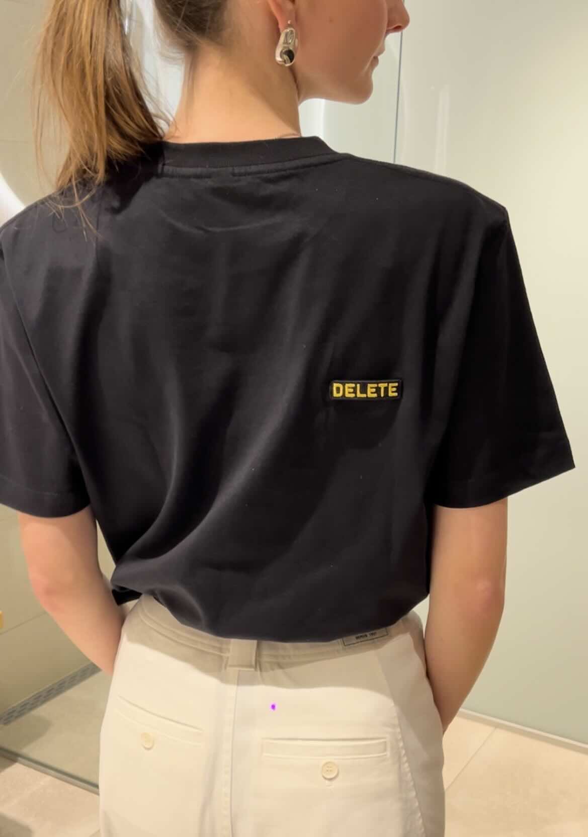 Earth Positive Might Delete Later T shirts with a laser cut word "DELETE"